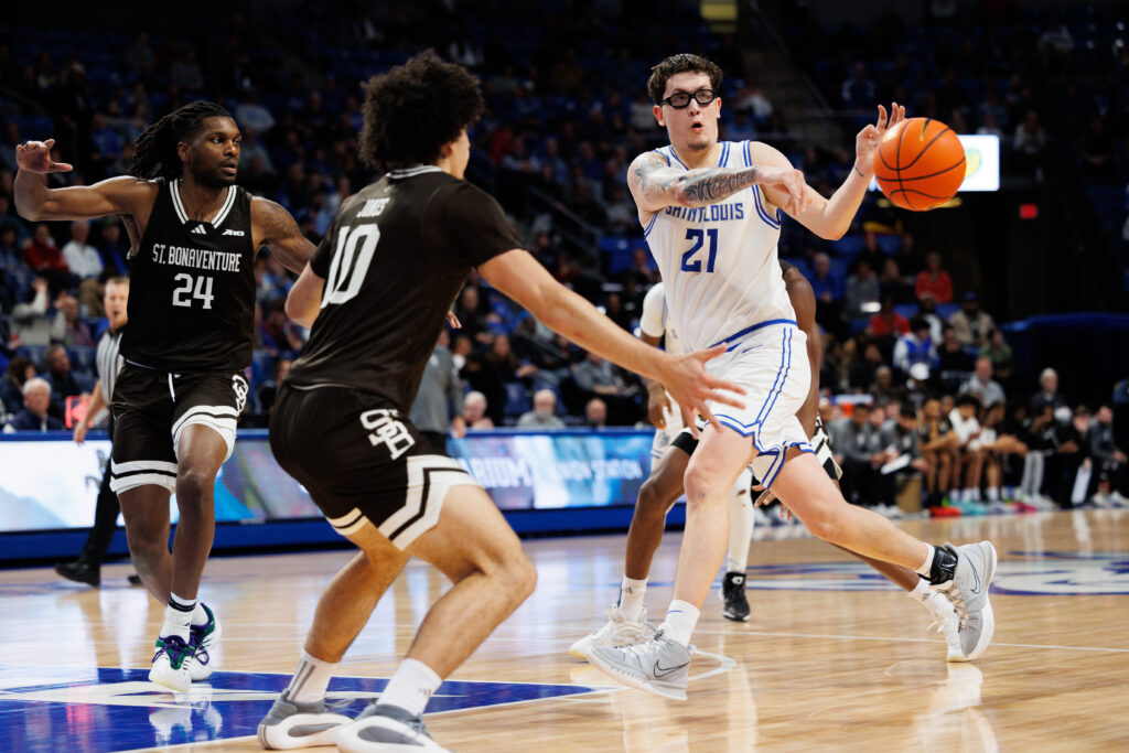 Billiken center Avila drives the lane and makes the pass