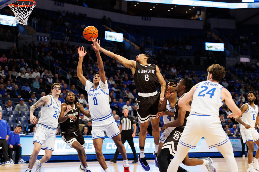 Sophomore guard Jonah Hinton of St. Bonaventure tries to lay it in against SLU's Kellen Thames