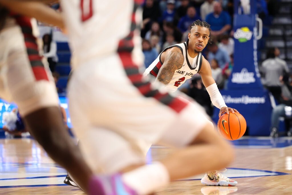 St. Joe senior Erik Reynolds II handles the ball in first half action
