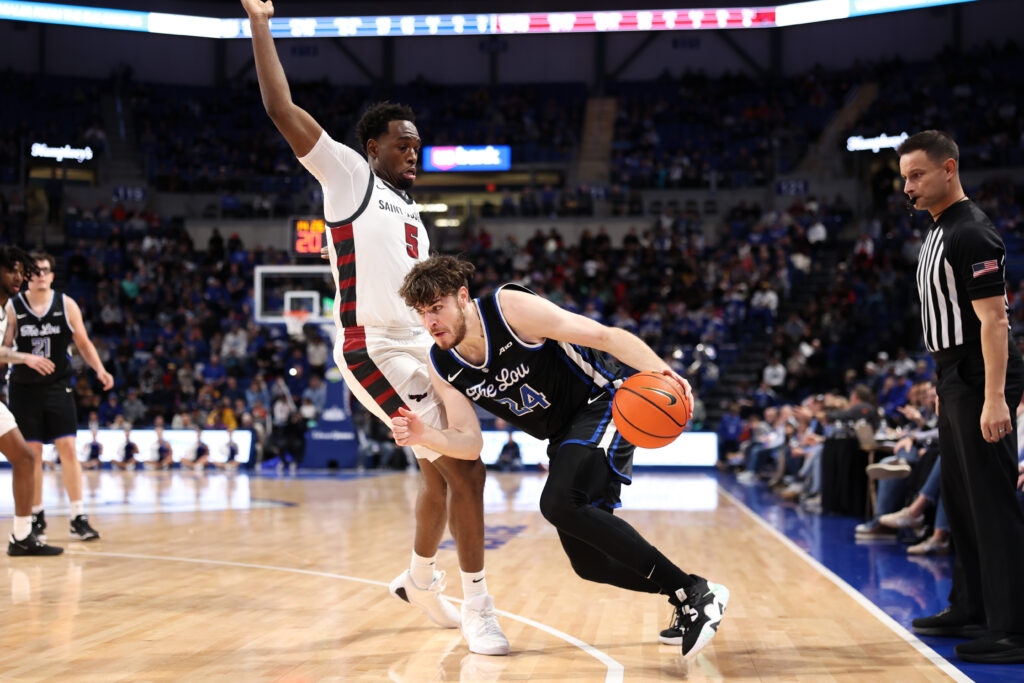 SLU's Jimerson drives past St. Joe's Anthony Finkley