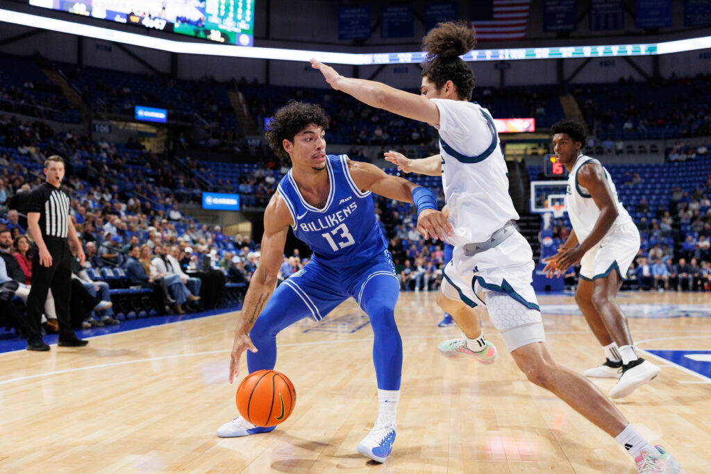 SLU's Dion Brown handles the ball in the first half against Chicago State. Malek Robinson defends (photo: Jeff Brown)