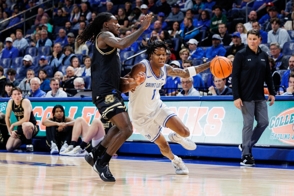 Billiken guard Quentin Jones is guarded by the Mastadon's DeAndre Craig Jr. (photo: Jeff Brown)